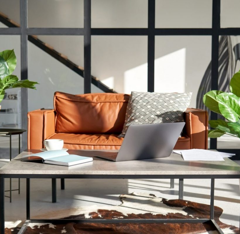 modern-sunny-living-room-interior-design-with-home-office-workplace-and-sofa--e1630595820740-pf2n5gl18ria8itloq7g6kb7yhtg5arpmdk8qv9dmo